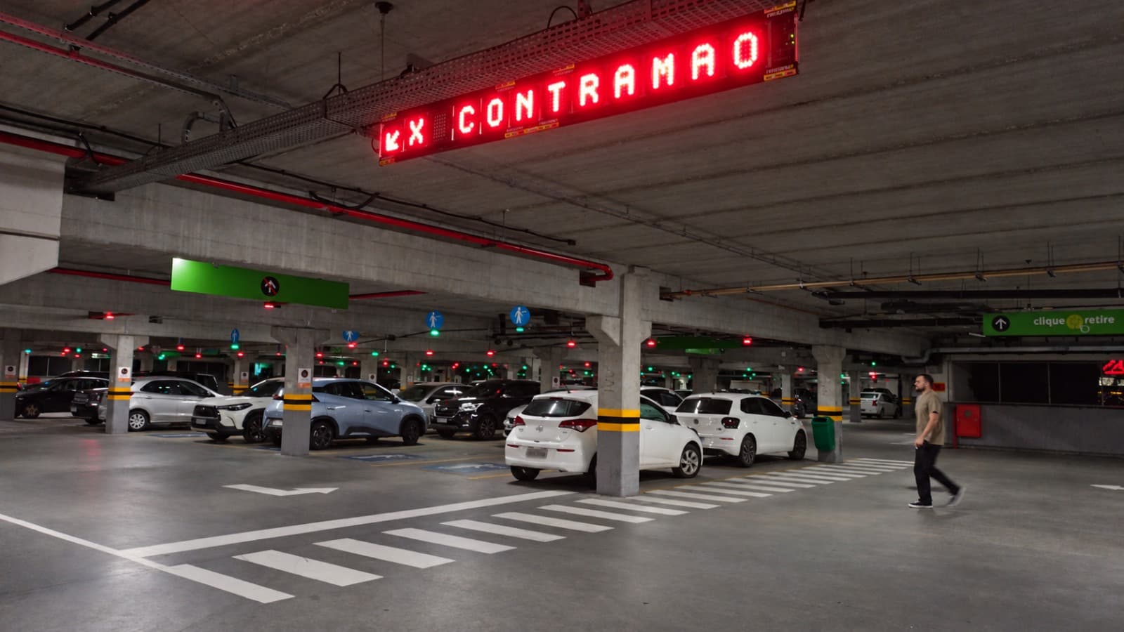 Red illuminated sign indicating no entry in the car park